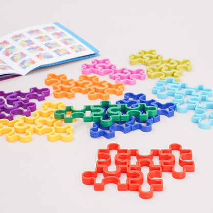 Inside pages of the PINOER 120-level progressive STEM challenge booklet displaying puzzle matrix solutions.