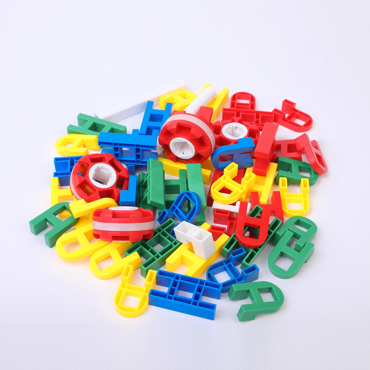 Close-up of 39 pieces of colorful H-shape and A-shape interlocking joint blocks on a white background.